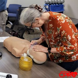 CPR training session with adult mannequin in Nashville.