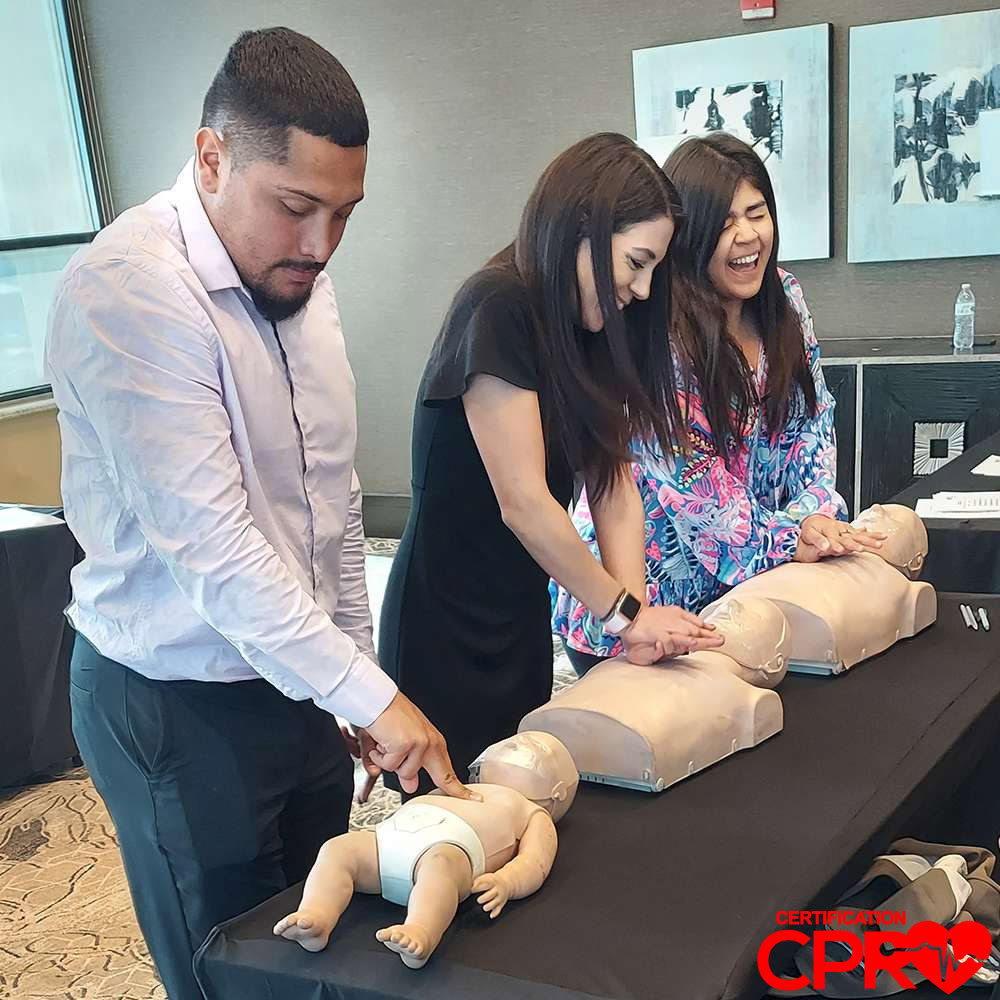 CPR training class in Nashville with students practicing on mannequins.